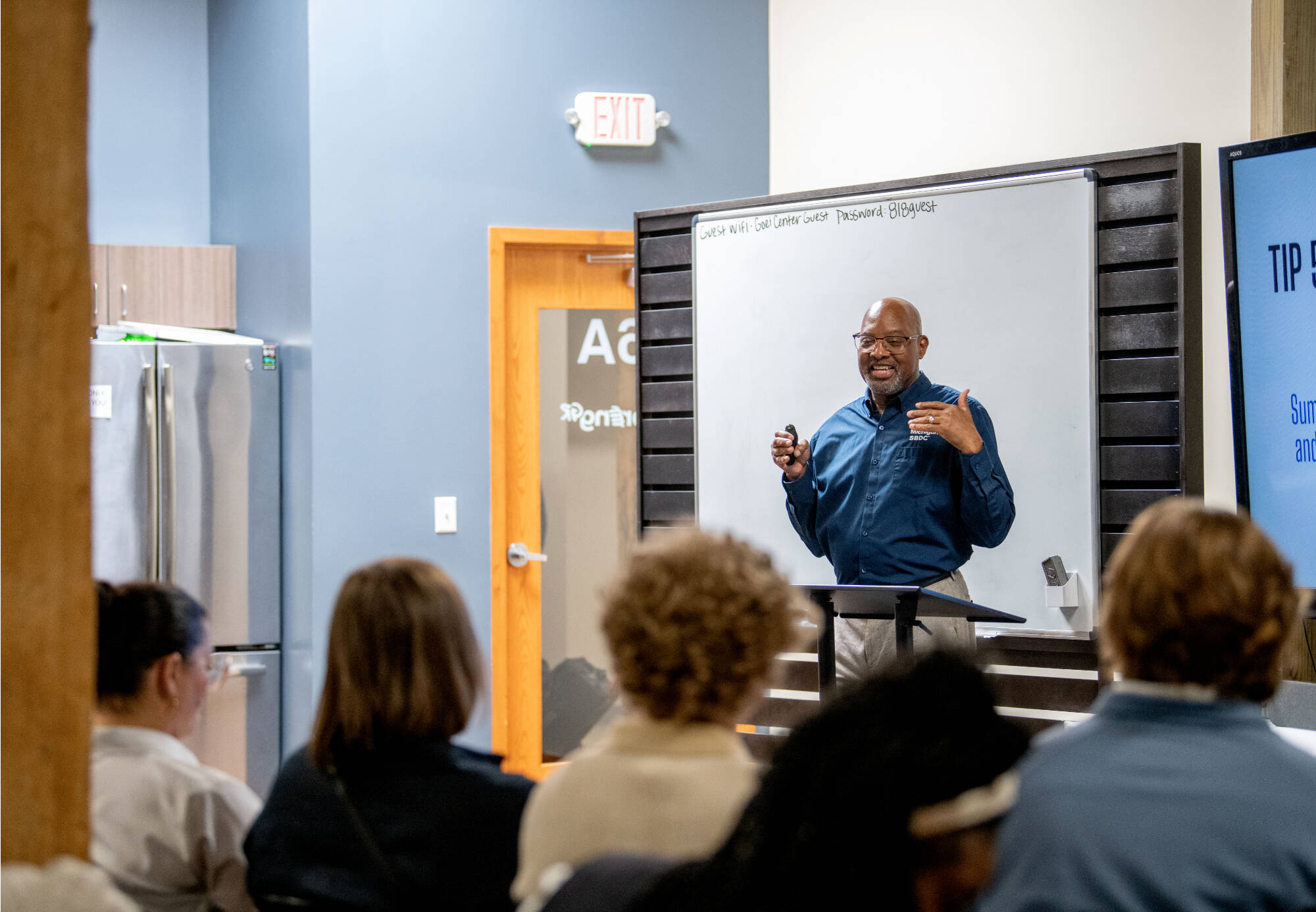 man presenting at business resource event
